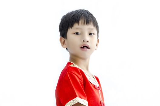 China boy in traditional Chinese red Tang suit greeting