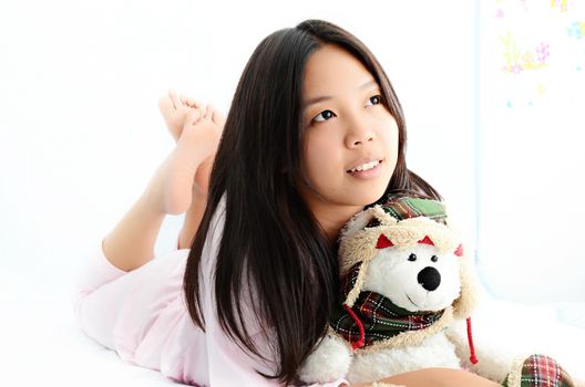 beautiful asian girl lying on the bed