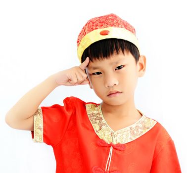 China boy in traditional Chinese red Tang suit greeting