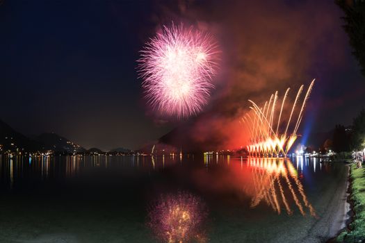 Fireworks on the Lugano Lake in a summer evening, Lavena-Ponte Tresa