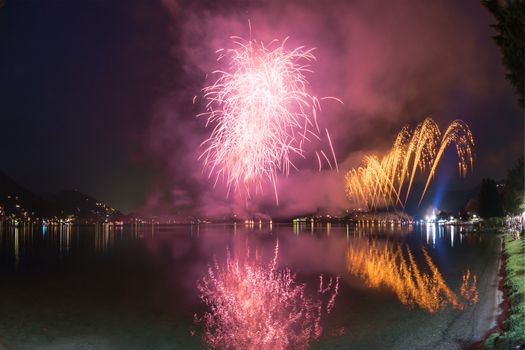 Fireworks on the Lugano Lake in a summer evening, Lavena-Ponte Tresa