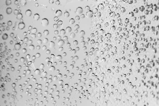 macro of sparkle water drops on dewy glass for background or backdrop