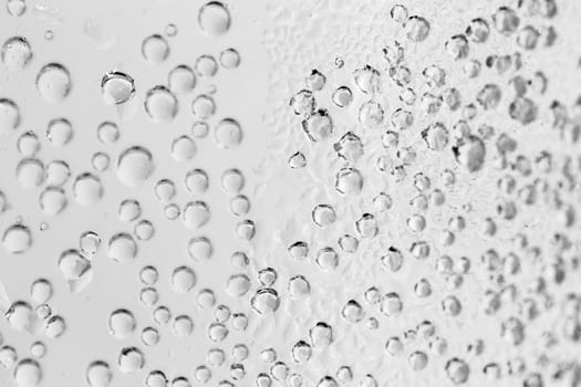 macro of sparkle water drops on dewy glass for background or backdrop