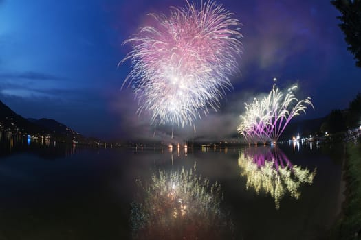 Fireworks on the Lugano Lake in a summer evening, Lavena-Ponte Tresa