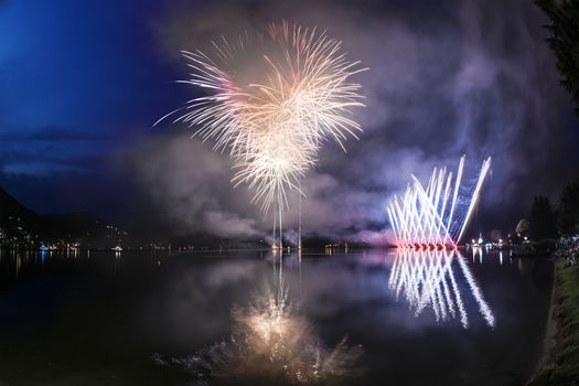 Fireworks on the Lugano Lake in a summer evening, Lavena-Ponte Tresa