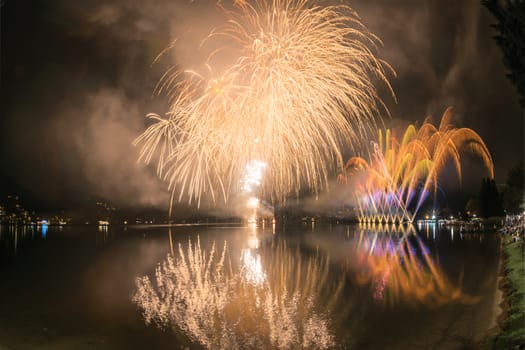 Fireworks on the Lugano Lake in a summer evening, Lavena-Ponte Tresa