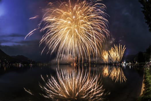 Fireworks on the Lugano Lake in a summer evening, Lavena-Ponte Tresa