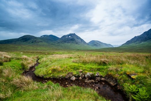 Beautiful landscape with Glencoe or Glen Coe mountains and pass with panoramic view over beautiful landscape in the Scottish Higlands, Scotland. UK.