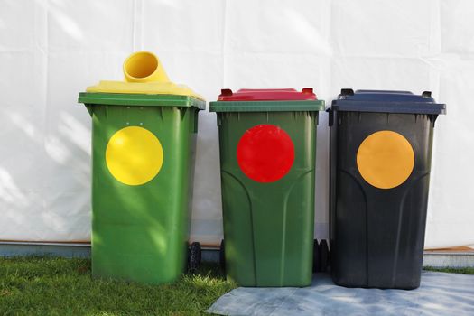 colored garbage bins to help separate and recycle