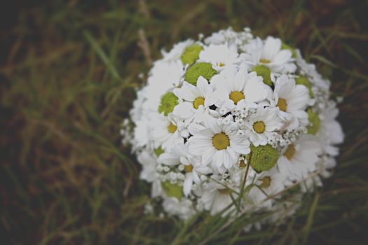 beautiful wedding flowers bouquet on the green grass