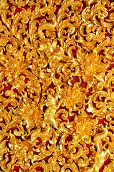 Thai Art of Gold wood Carving on red background