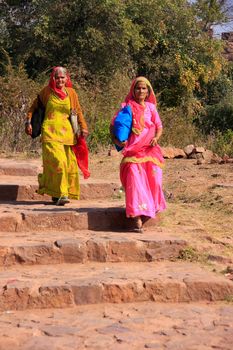 Indian women in colorful saris walking at Ranthambore Fort, Rajasthan, India