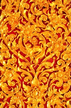 Thai Art of Gold wood Carving on red background