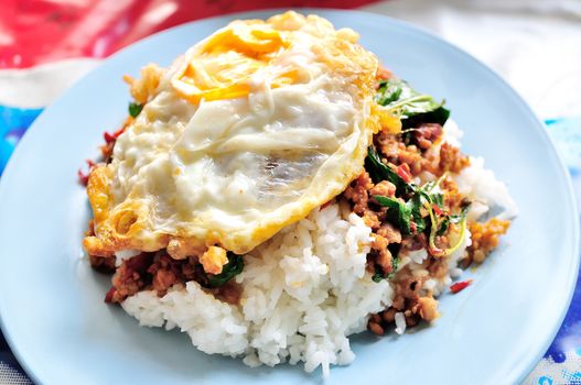 stir fried minced pork and chili ,basil served with steamed rice and fried egg 