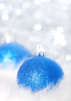 Blue christmas balls on abstract silver background