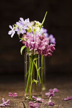 Bouquet of spring flowers on wooden background