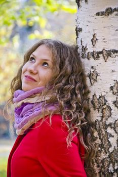 Photo of beautiful young woman in the autumn