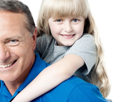 Happy man piggybacking his cheerful daughter