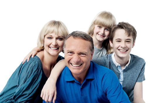 Smiling affectionate family of four