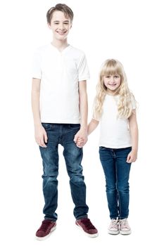 Young brother and sister holding hands