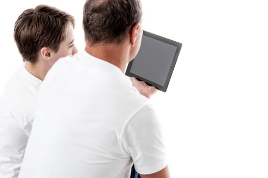 Father and son working with tablet pc against white background