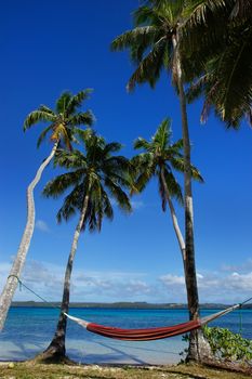 Colorful hammock between palm trees, Ofu island, Vavau group, Tonga