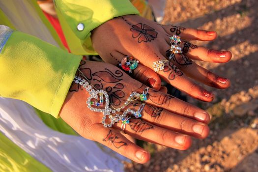 Local girl showing henna painting, Khichan village, Rajasthan, India