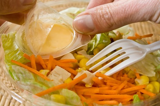 Closeup of take away bowl with fast food salad