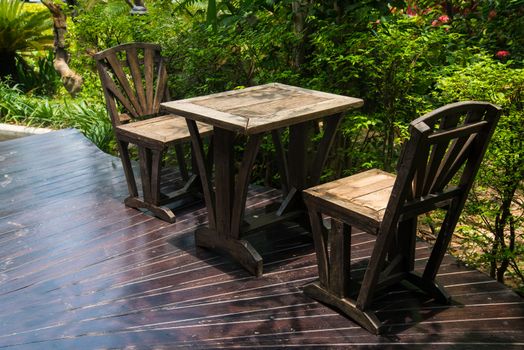 Wooden table and chairs in the garden.