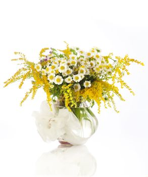 Beautiful bouquet of wildflowers in vase isolated on white