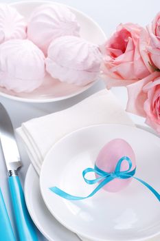 Easter table setting with flowers and easter egg