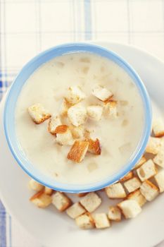 Vegetable cream soup in blue bowls