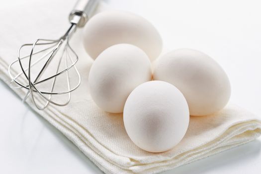 Fresh eggs with whisk for baking