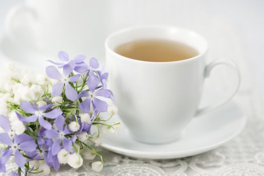 Cup of tea and spring flowers 