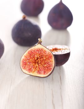 Fresh figs on wood background