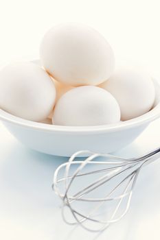 Fresh eggs with whisk for baking