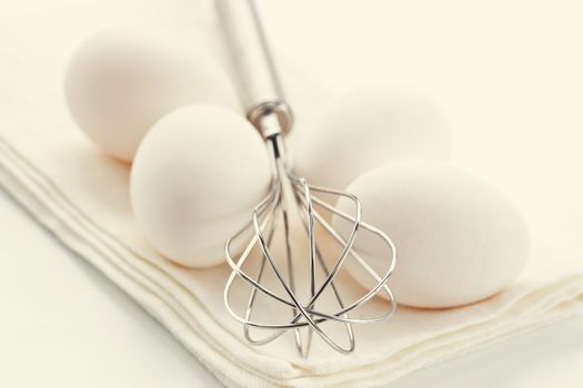 Fresh eggs with whisk for baking