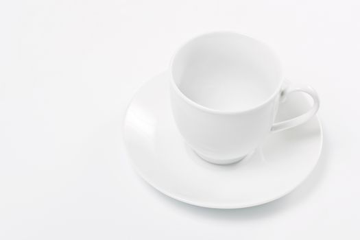 Empty white cup over white background