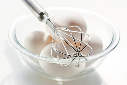 Fresh eggs with whisk for baking