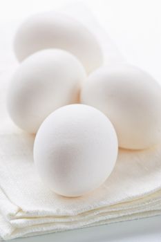 Fresh eggs on white background