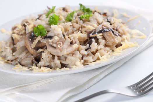 Mushroom risotto with parsley, italian cuisine.