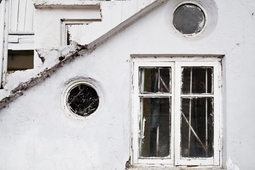 Vintage windows in old white house  