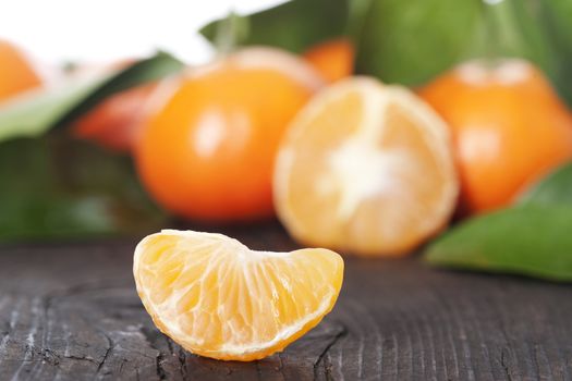 Ripe tangerines on a wooden table