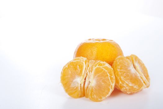 Ripe tangerines on white background. 