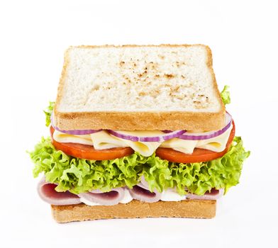 Sandwich with ham, cheese, tomatoes, onions and lettuce.