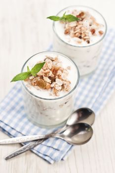 Natural yogurt with muesli in glass