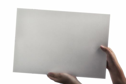 A light white plastic laminate square blank sign supported by young hands on light background