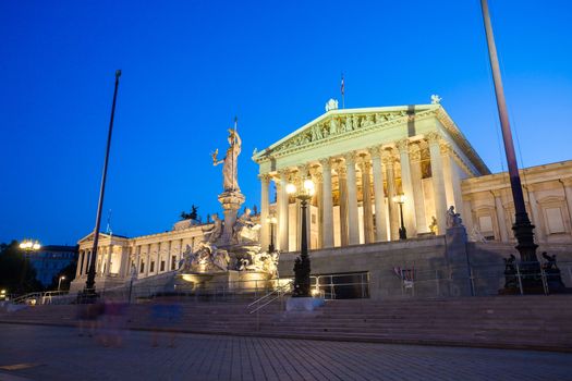 Austrian Parliament Building and The Athena Fountain at night.