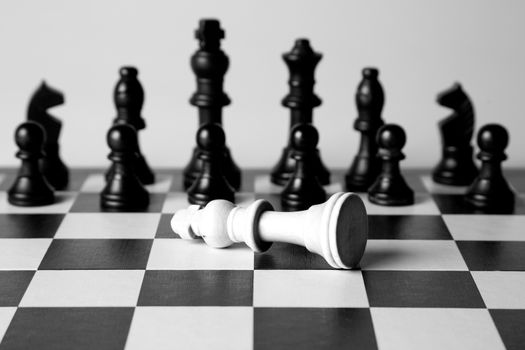 Black and white king on a chess board