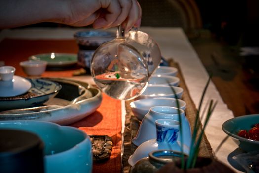 Traditional chinese tea making in dark with soft focus
